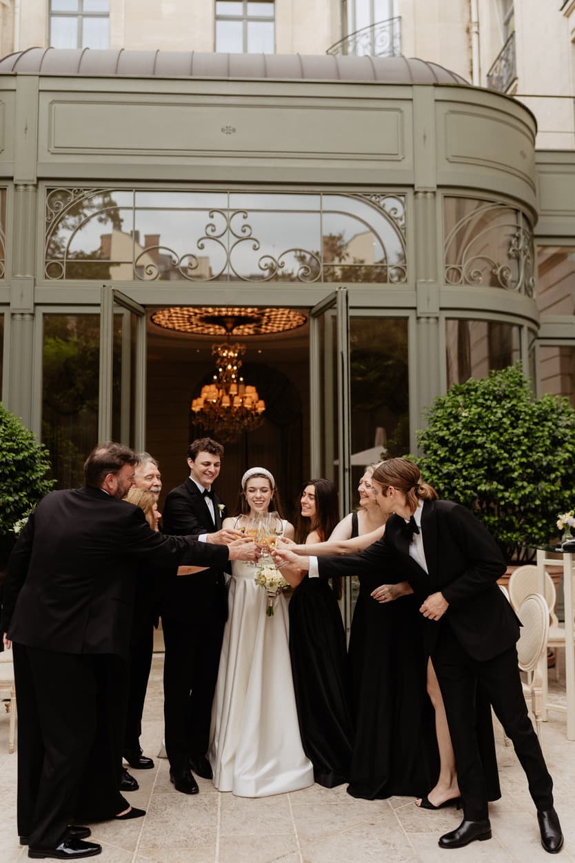 Destination wedding elopement at the luxurious Ritz Paris couple and families toasting