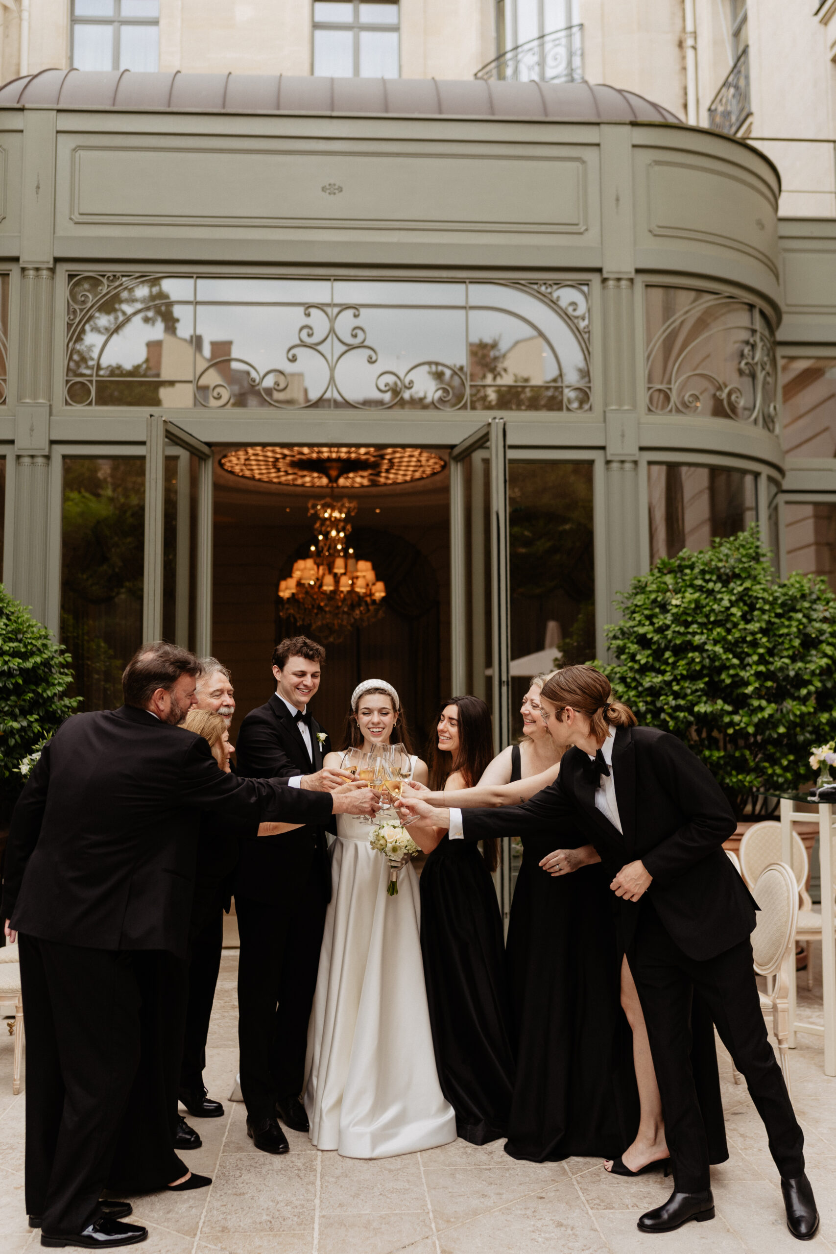 Destination wedding elopement at the luxurious Ritz Paris couple and families toasting 