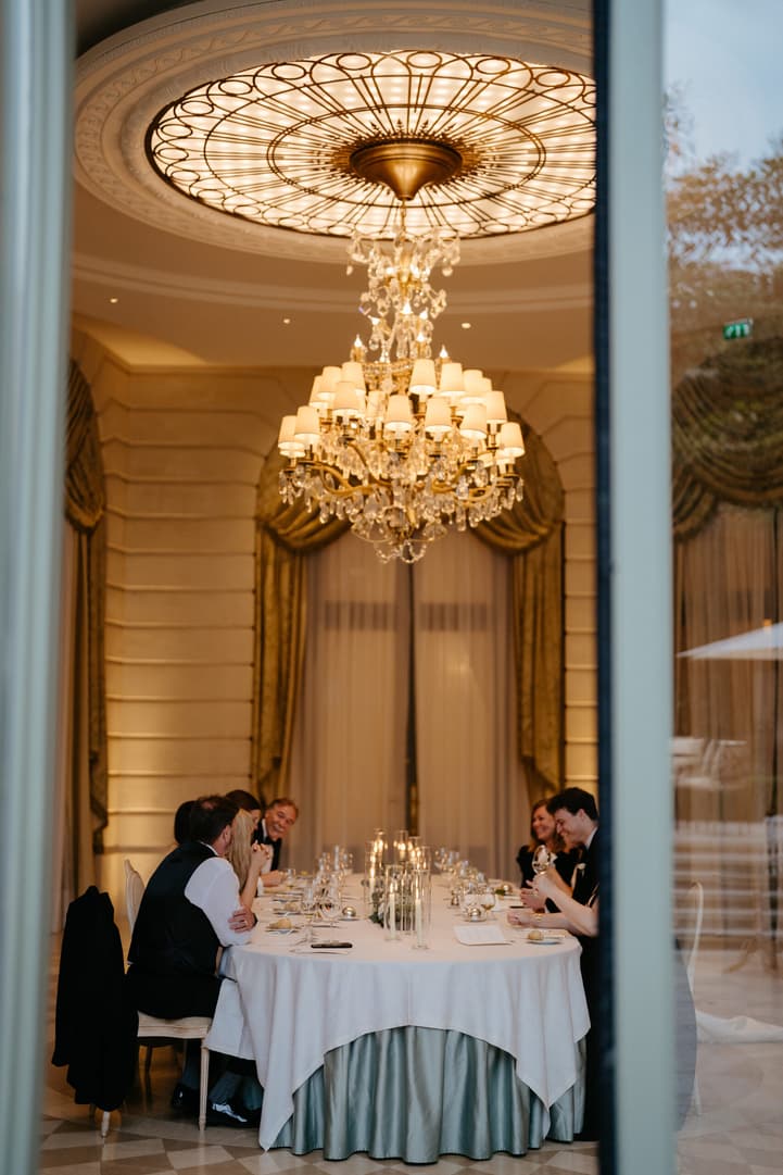 Destination wedding elopement at the luxurious Ritz Paris couple and families during dinner