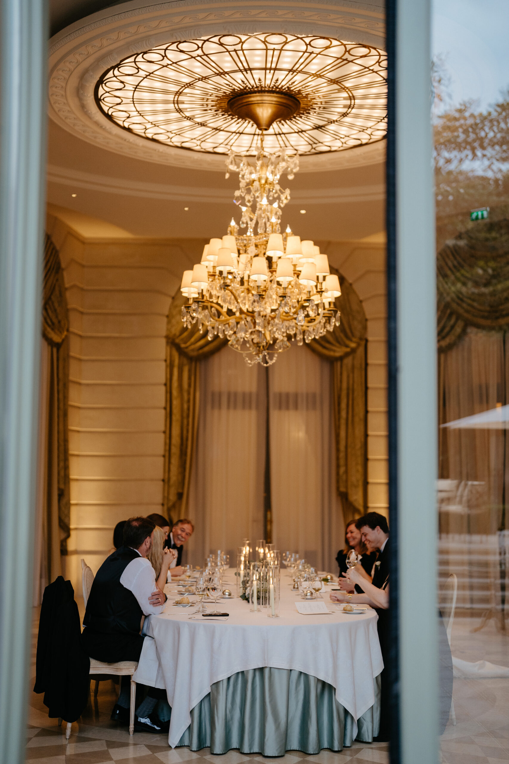 Destination wedding elopement at the luxurious Ritz Paris couple and families  during dinner 