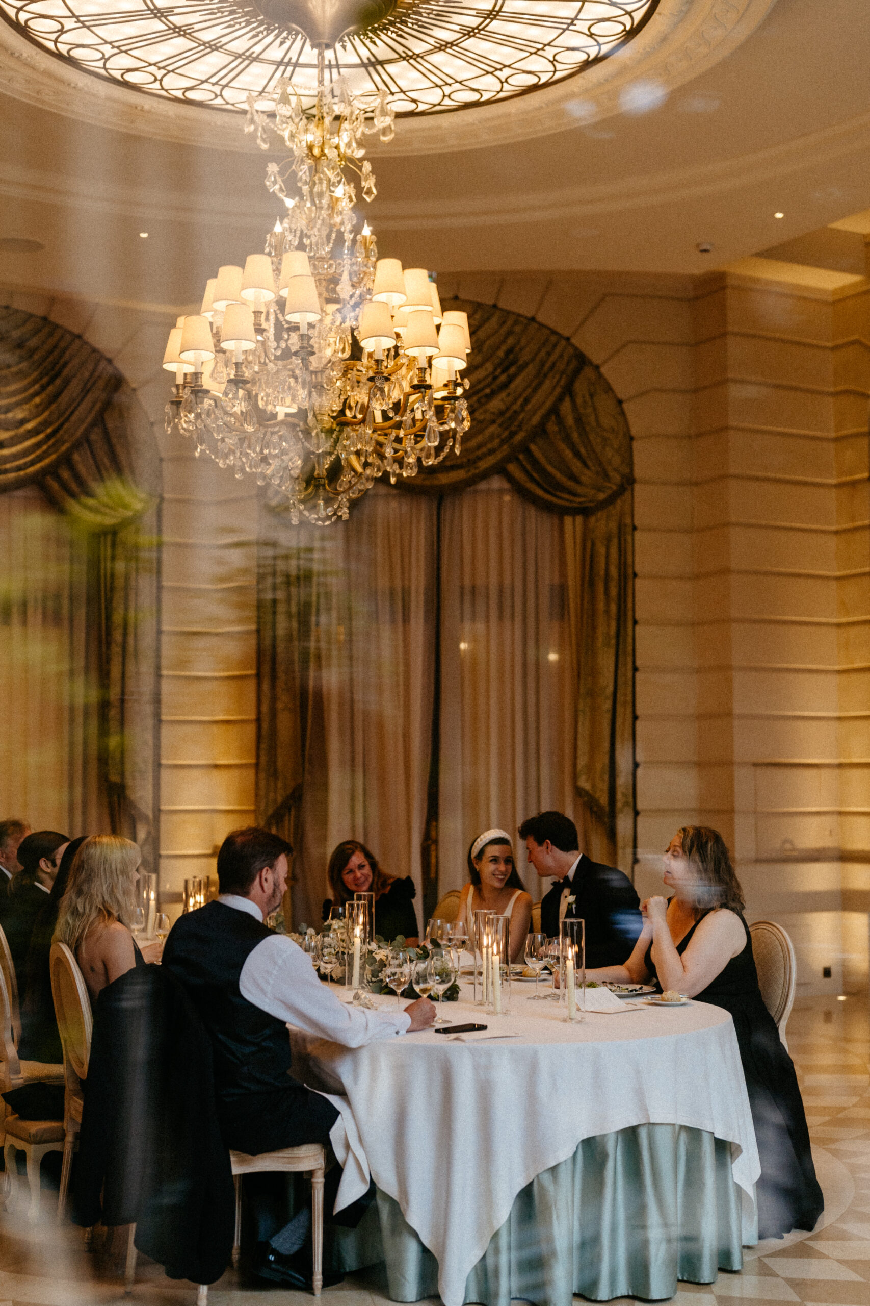 Destination wedding elopement at the luxurious Ritz Paris couple and families  during dinner 