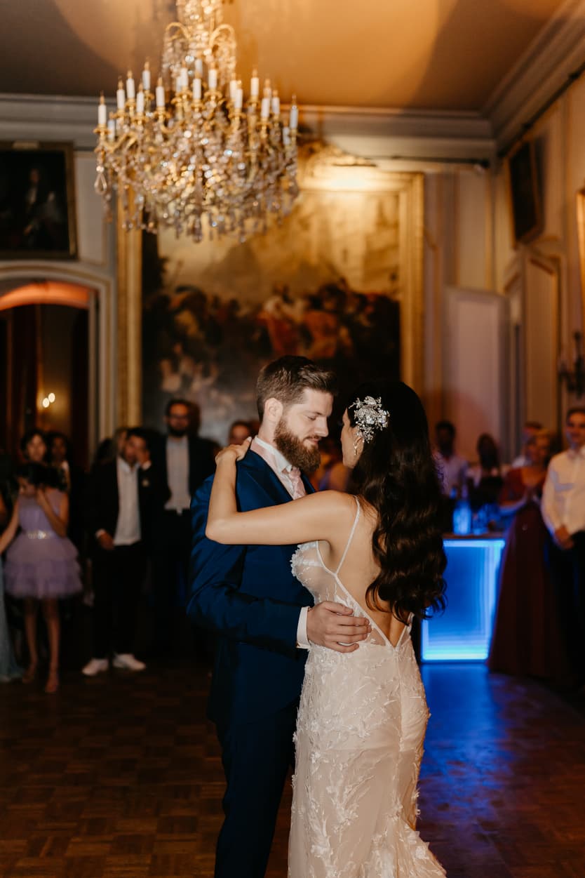 The first dance in the salon, the guests standing around the floor