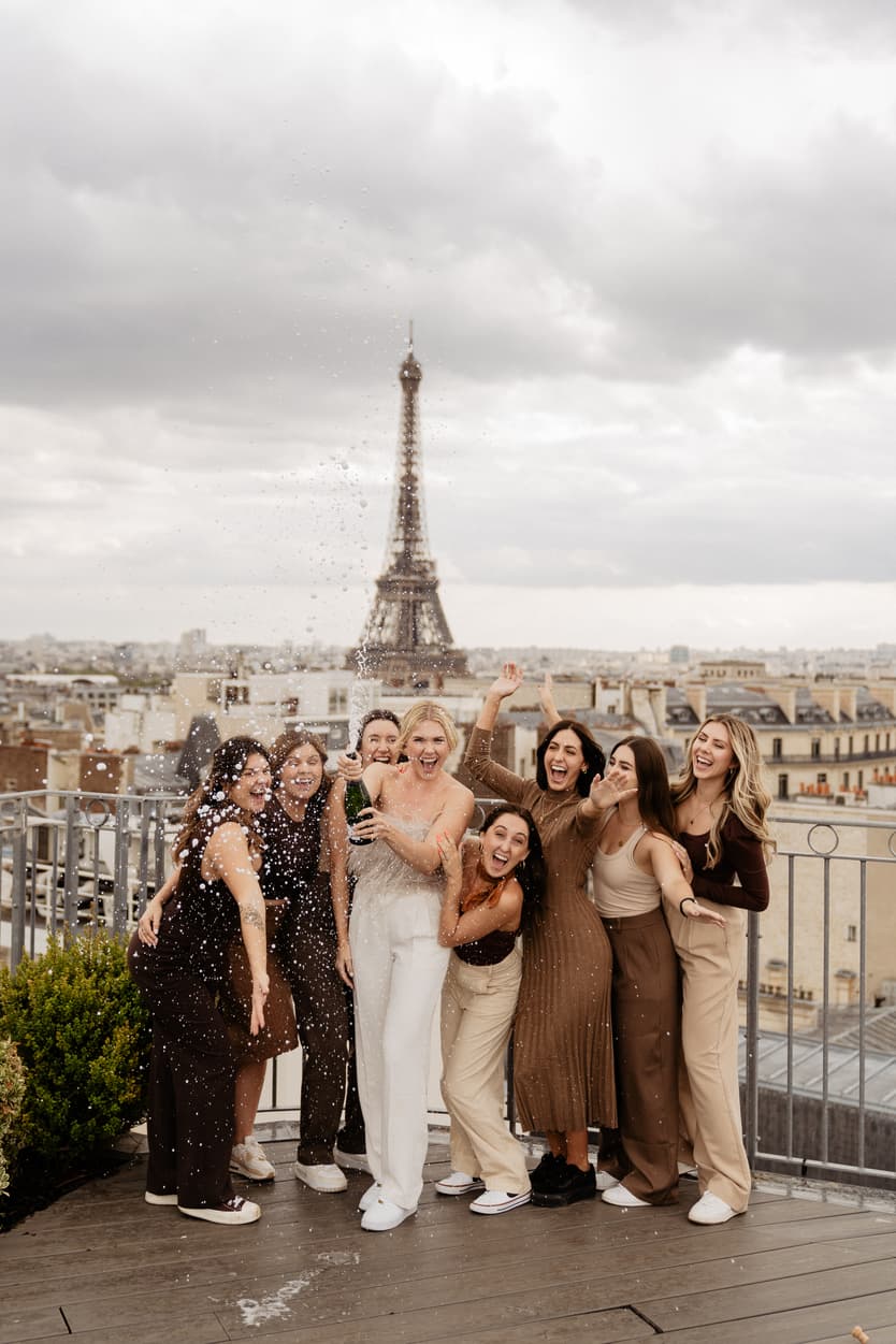 Destination elopement wedding Paris bachelorette bride champagne pop