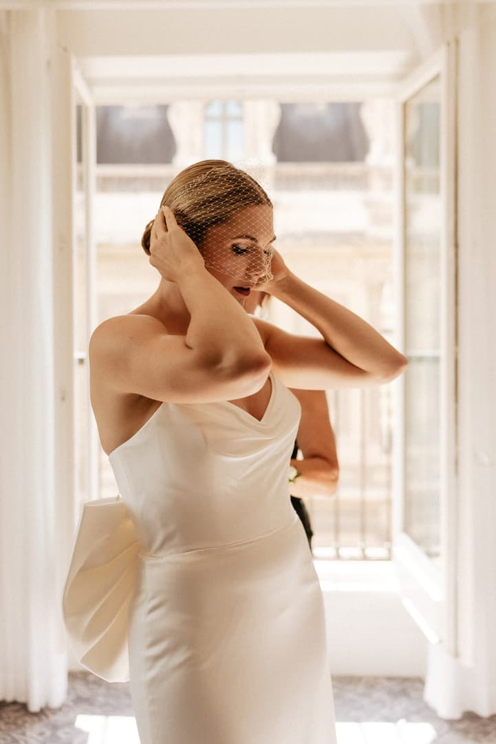 Destination elopement wedding Paris preparations Hotel du Louvre bride