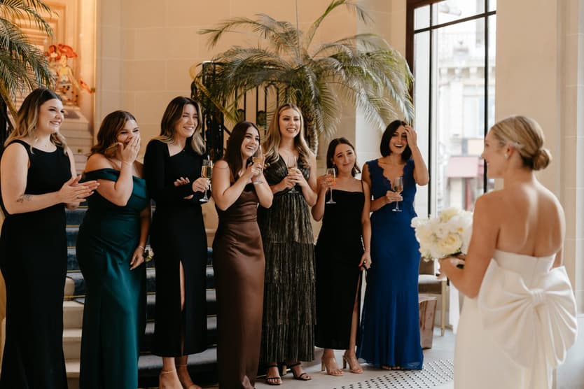 Destination elopement wedding Paris Hotel du Louvre first look with bridesmaids