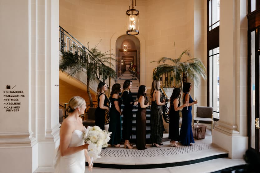 Destination elopement wedding Paris Hotel du Louvre first look with bridesmaids