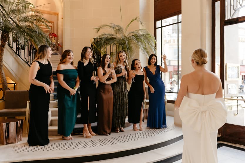 Destination elopement wedding Paris Hotel du Louvre first look with bridesmaids