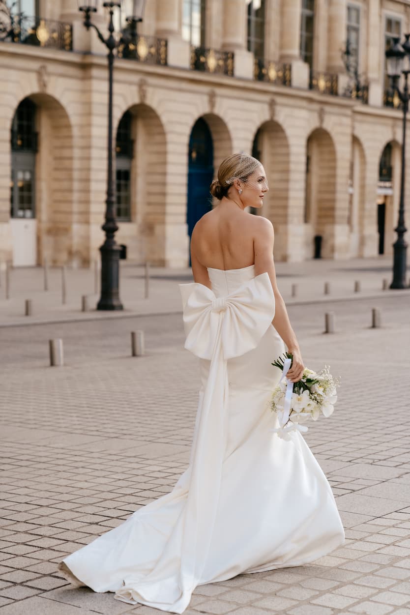 Destination elopement wedding Paris Place Vedome bride from back 