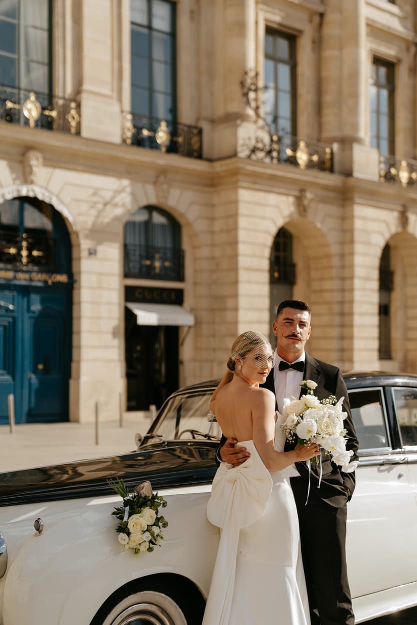Destination elopement wedding Paris Place Vedome couple with vintage car 