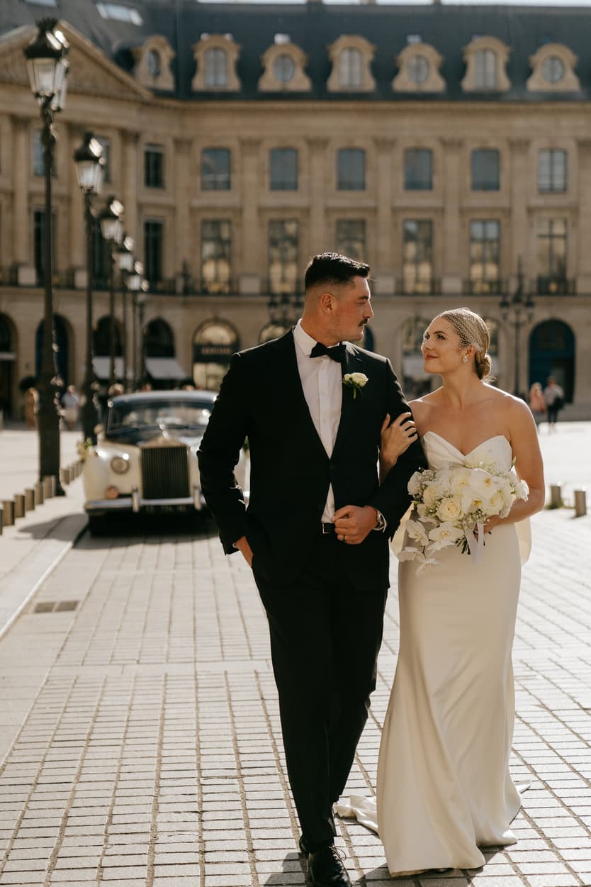 Destination elopement wedding Paris Place Vedome couple walking and vintage car 
