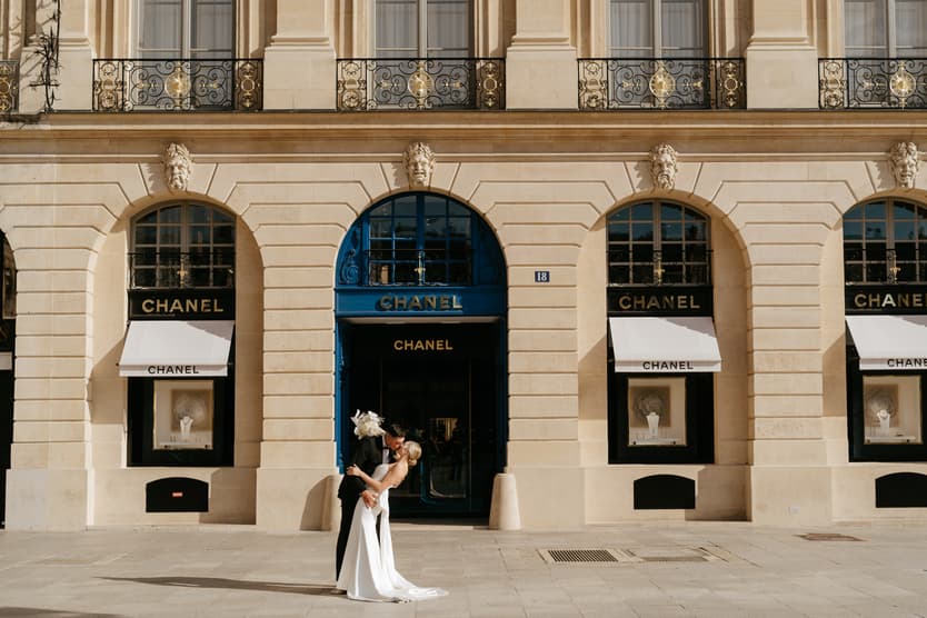 Destination elopement wedding Paris Place Vedome Chanel store couple kissing 