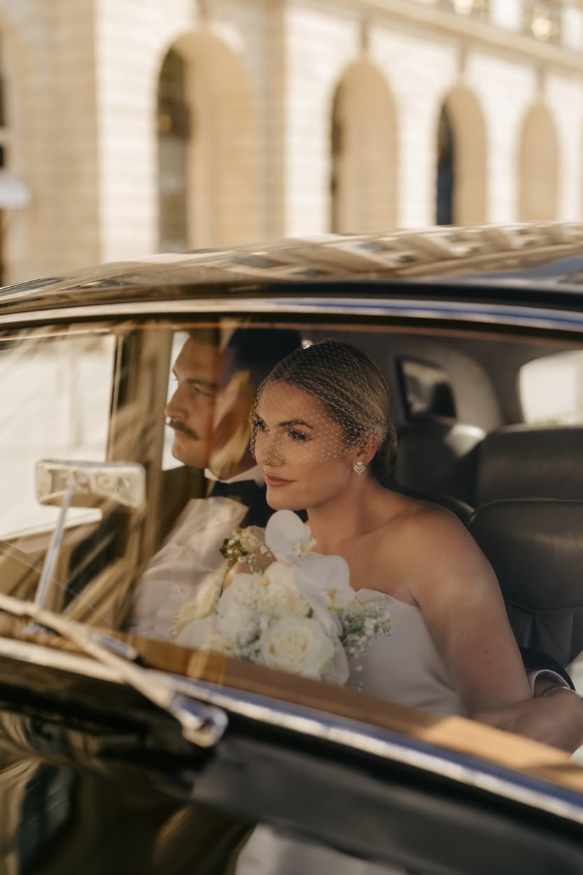 Destination elopement wedding Paris Place Vedome couple in vintage car 