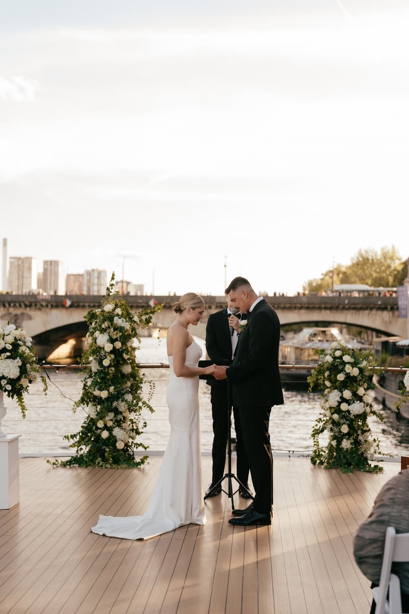 Destination elopement wedding Paris yacht ceremony with Eiffel Tower backdrop