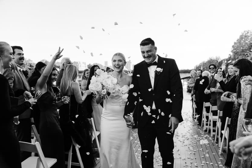Destination elopement wedding Paris yacht ceremony with Eiffel Tower backdrop petal toss