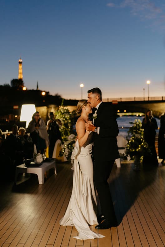 Destination elopement wedding Paris yacht with Eiffel Tower backdrop first dance 