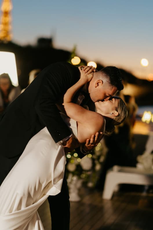 Destination elopement wedding Paris yacht with Eiffel Tower backdrop first dance 