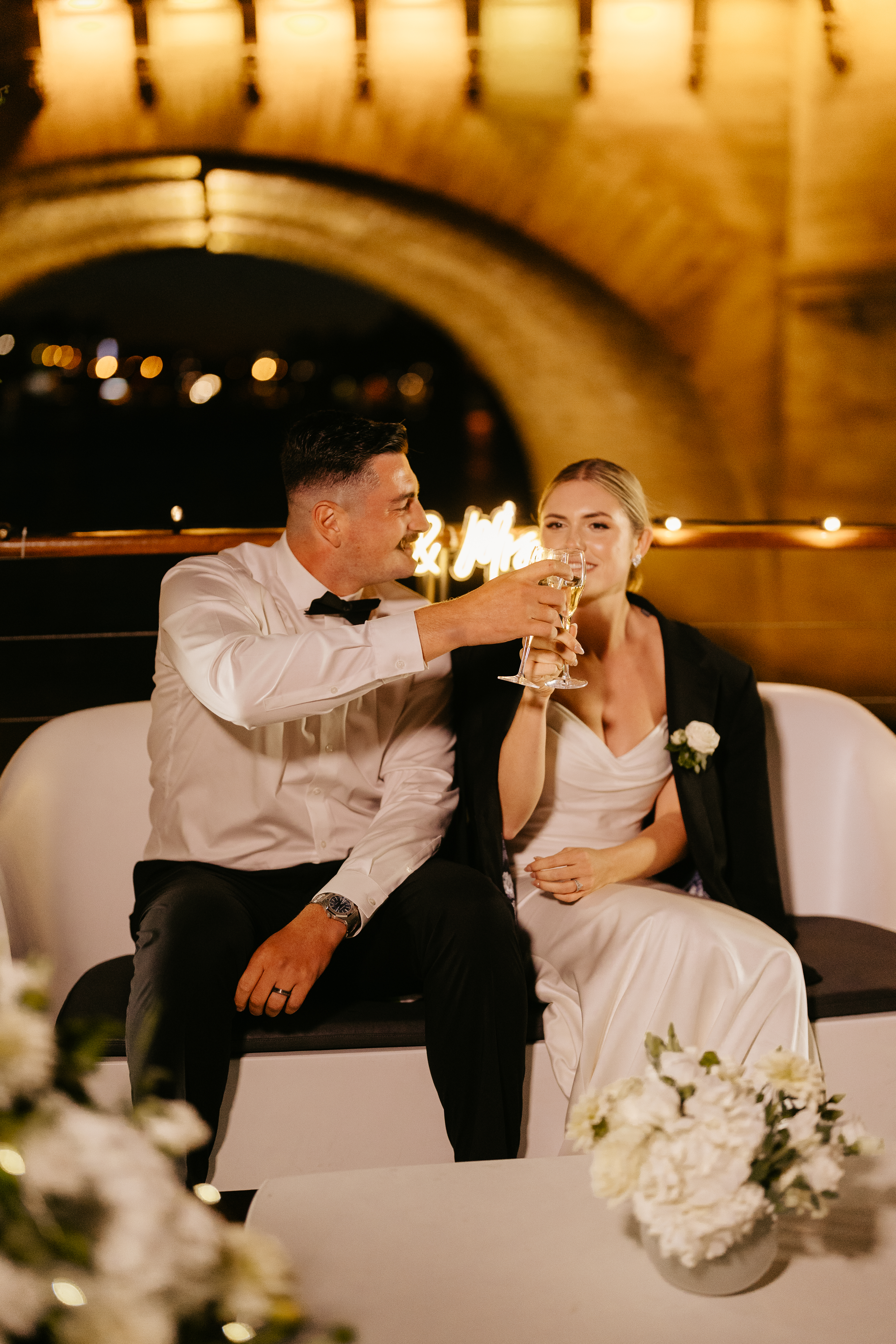 Destination elopement wedding Paris yacht couple toasting