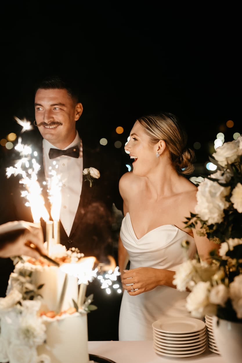 Destination elopement wedding Paris yacht couple with cake 