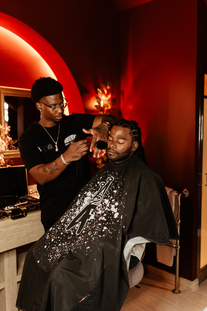 Destination elopement wedding Hotel Particulier Montmartre, Paris preparations groom with personal barber