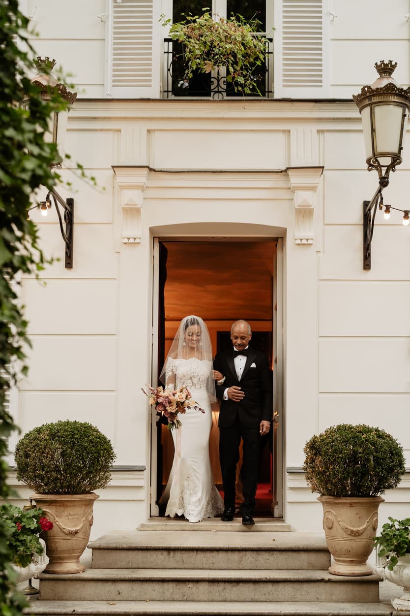 Destination elopement wedding Hotel Particulier Montmartre, Paris garden ceremony bride walking with her dad 
