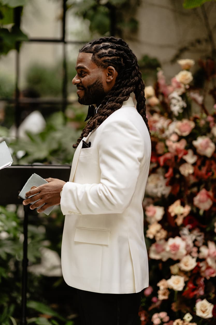 Destination elopement wedding Hotel Particulier Montmartre, Paris garden ceremony groom reading vows 