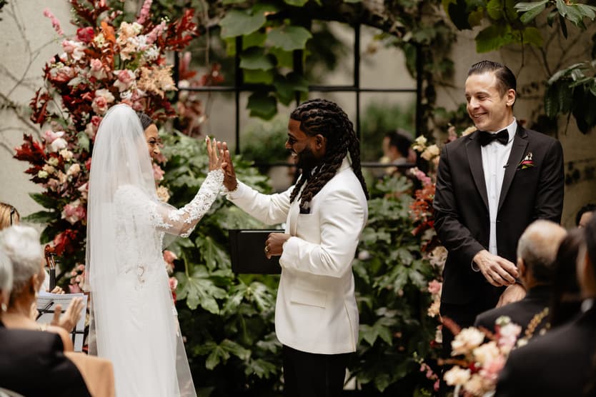 Destination elopement wedding Hotel Particulier Montmartre, Paris garden ceremony couple's handshake