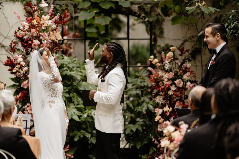Destination elopement wedding Hotel Particulier Montmartre, Paris garden ceremony couple's handshake