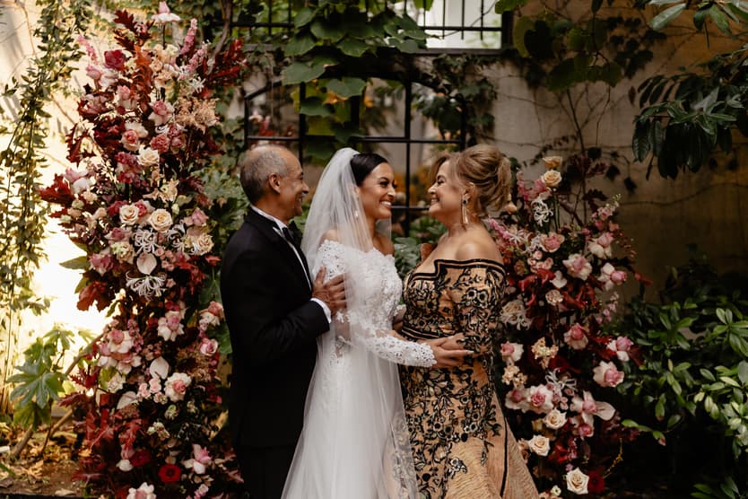 Destination elopement wedding Hotel Particulier Montmartre, Paris bride and family near the flower decorations