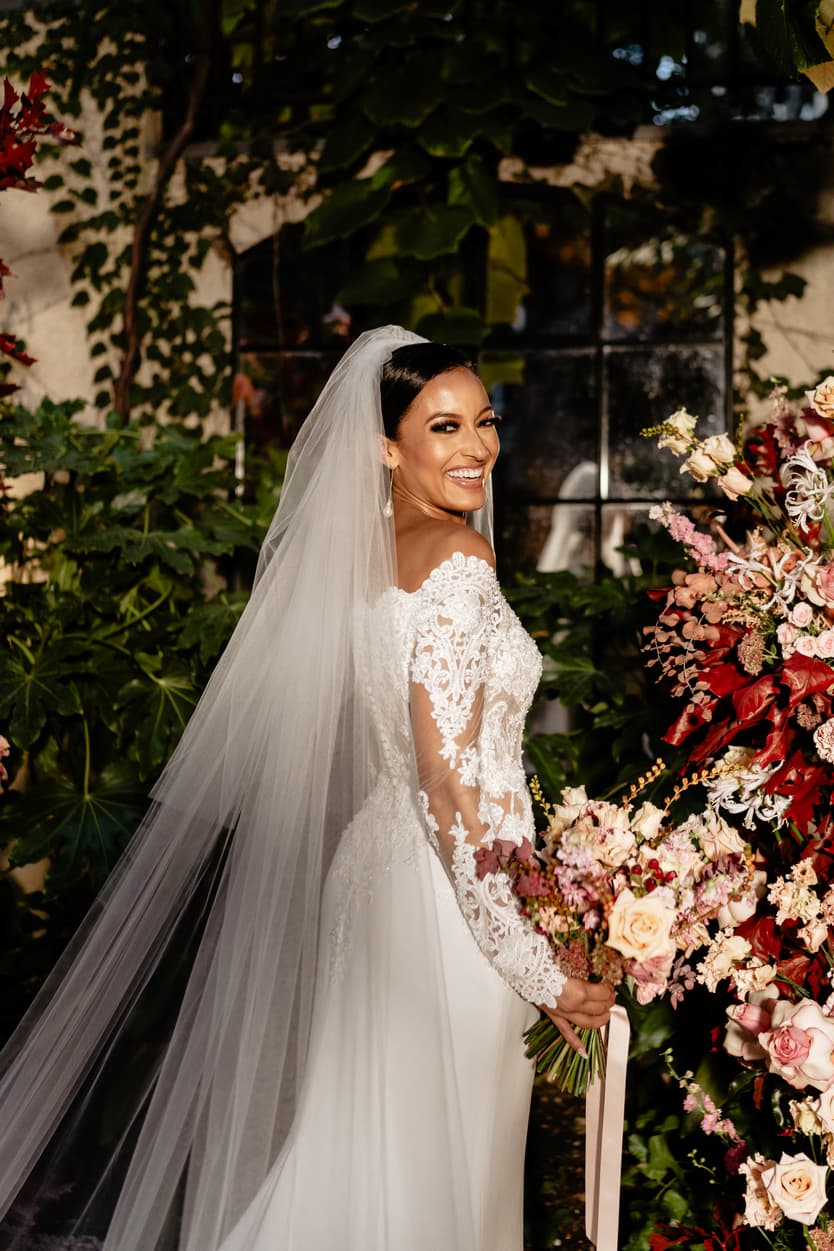 Destination elopement wedding Hotel Particulier Montmartre, Paris bride near the flower decorations