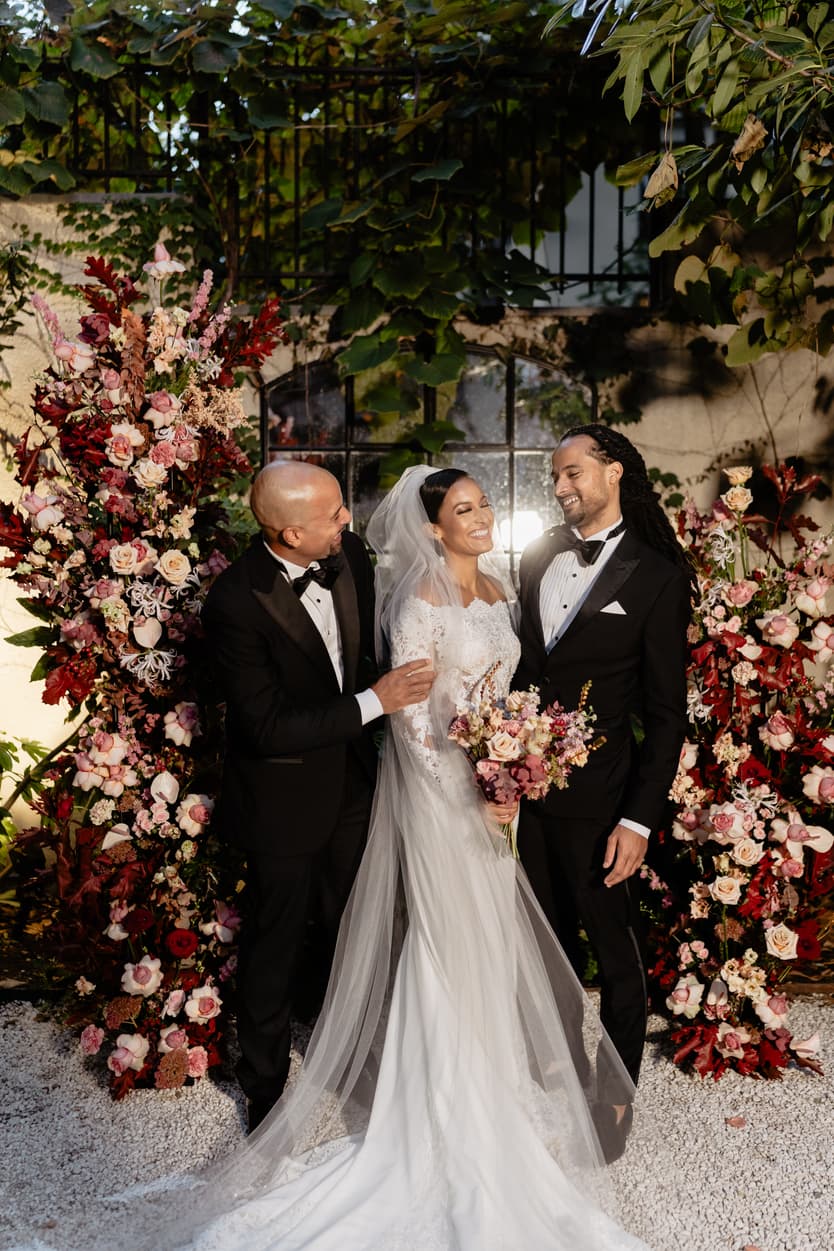 Destination elopement wedding Hotel Particulier Montmartre, Paris bride and brothers near the flower decorations