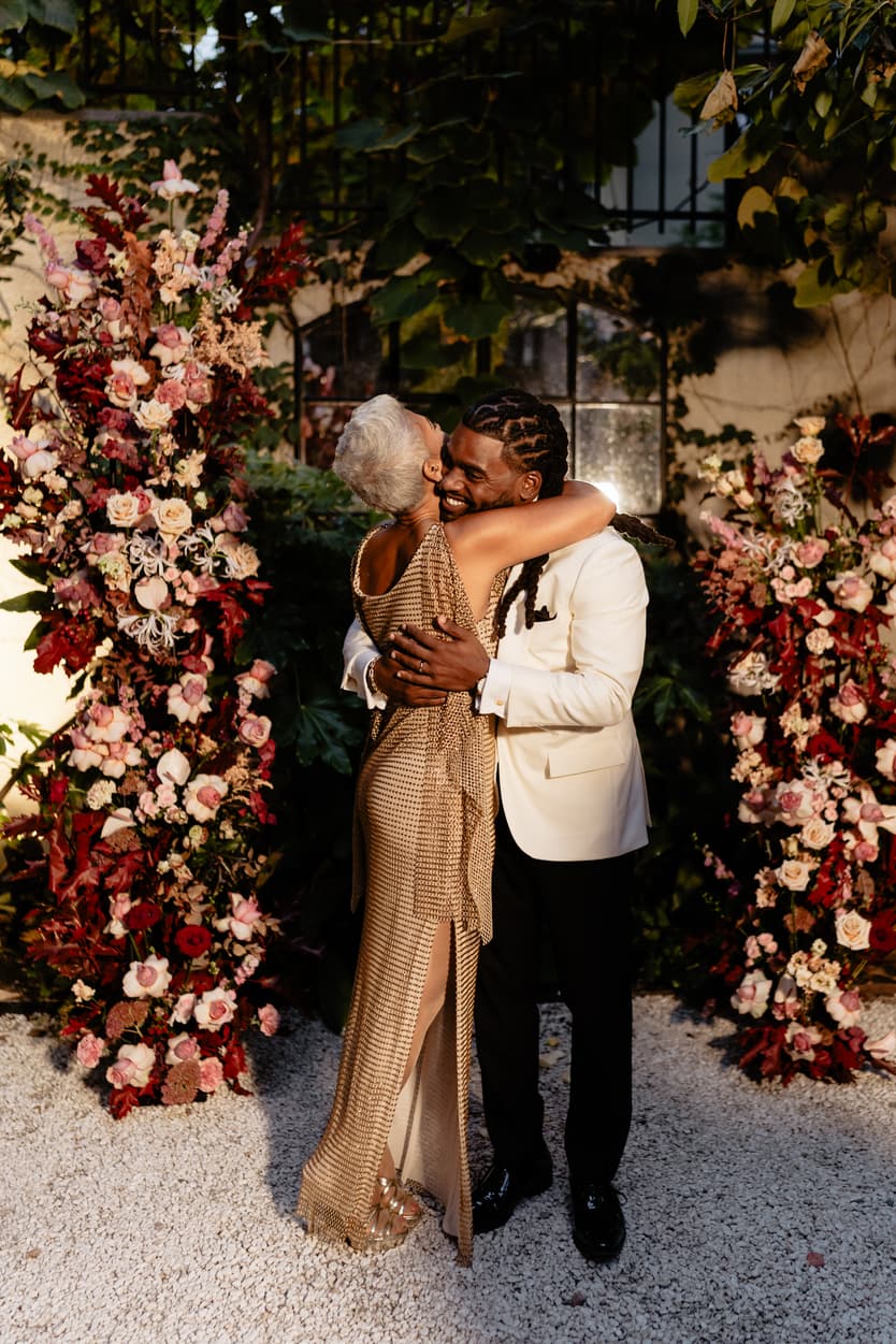 Destination elopement wedding Hotel Particulier Montmartre, Paris groom and mom near the flower decorations