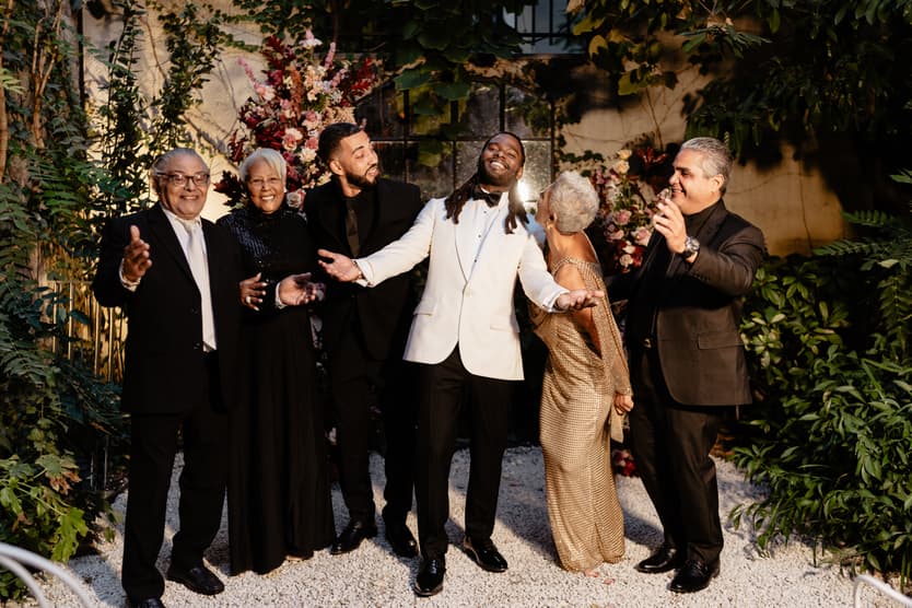 Destination elopement wedding Hotel Particulier Montmartre, Paris groom and family near the flower decorations