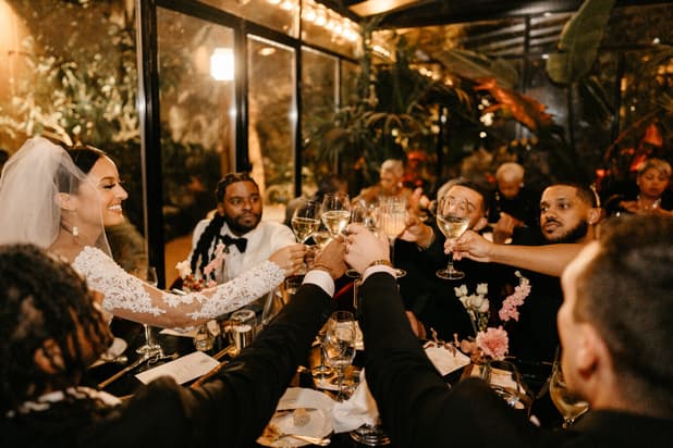 Destination elopement wedding Hotel Particulier Montmartre, Paris couple and guests toasting 