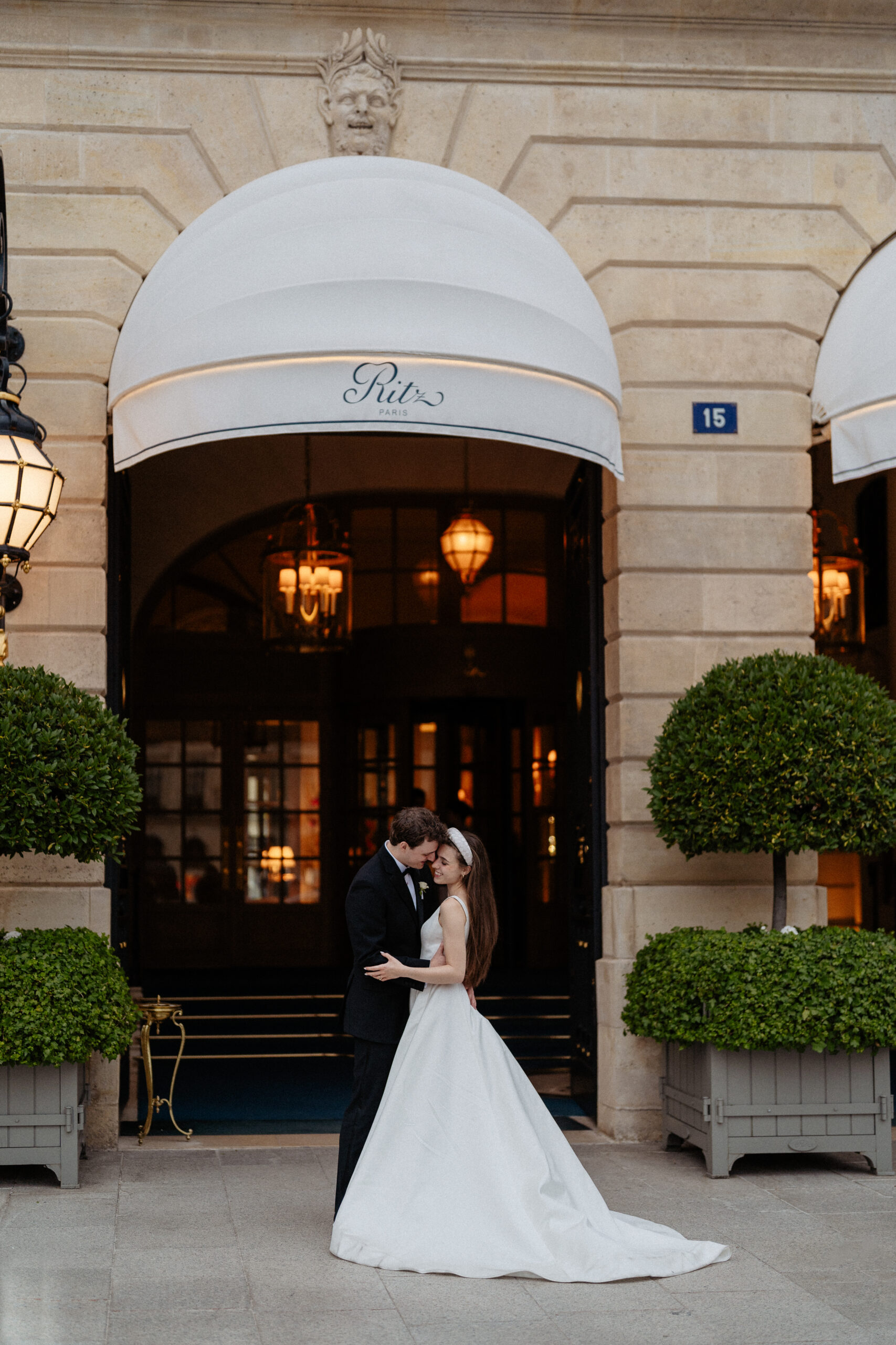 Destination wedding elopement at the luxurious Ritz Paris couple in front of  the hotel 