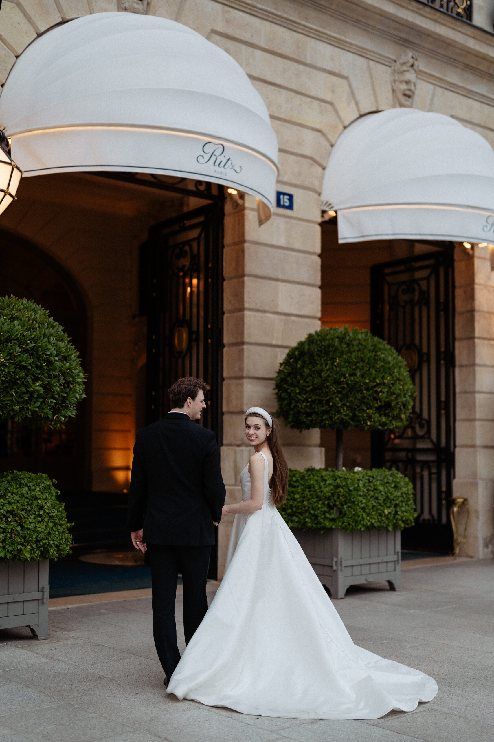 Destination wedding elopement at the luxurious Ritz Paris couple in front of  the hotel 