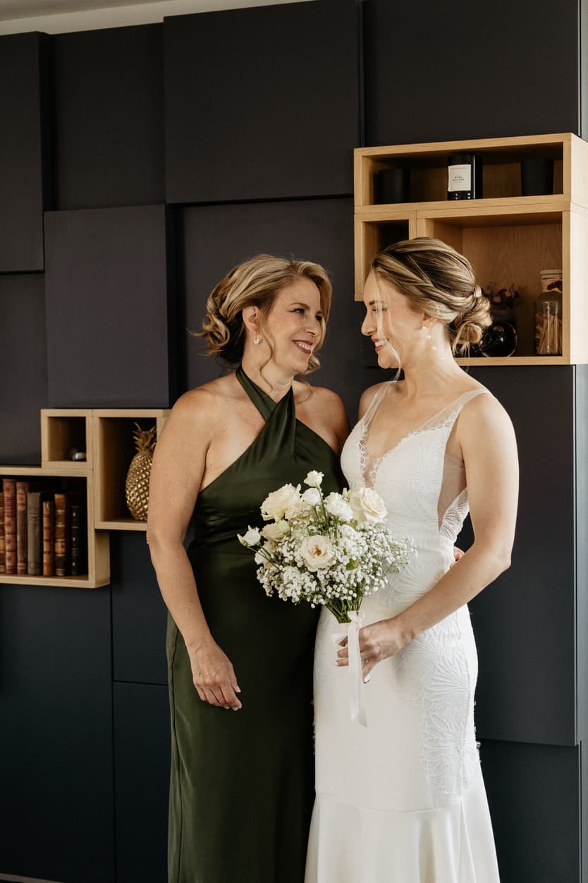 Bride preparing moment with mom and sister