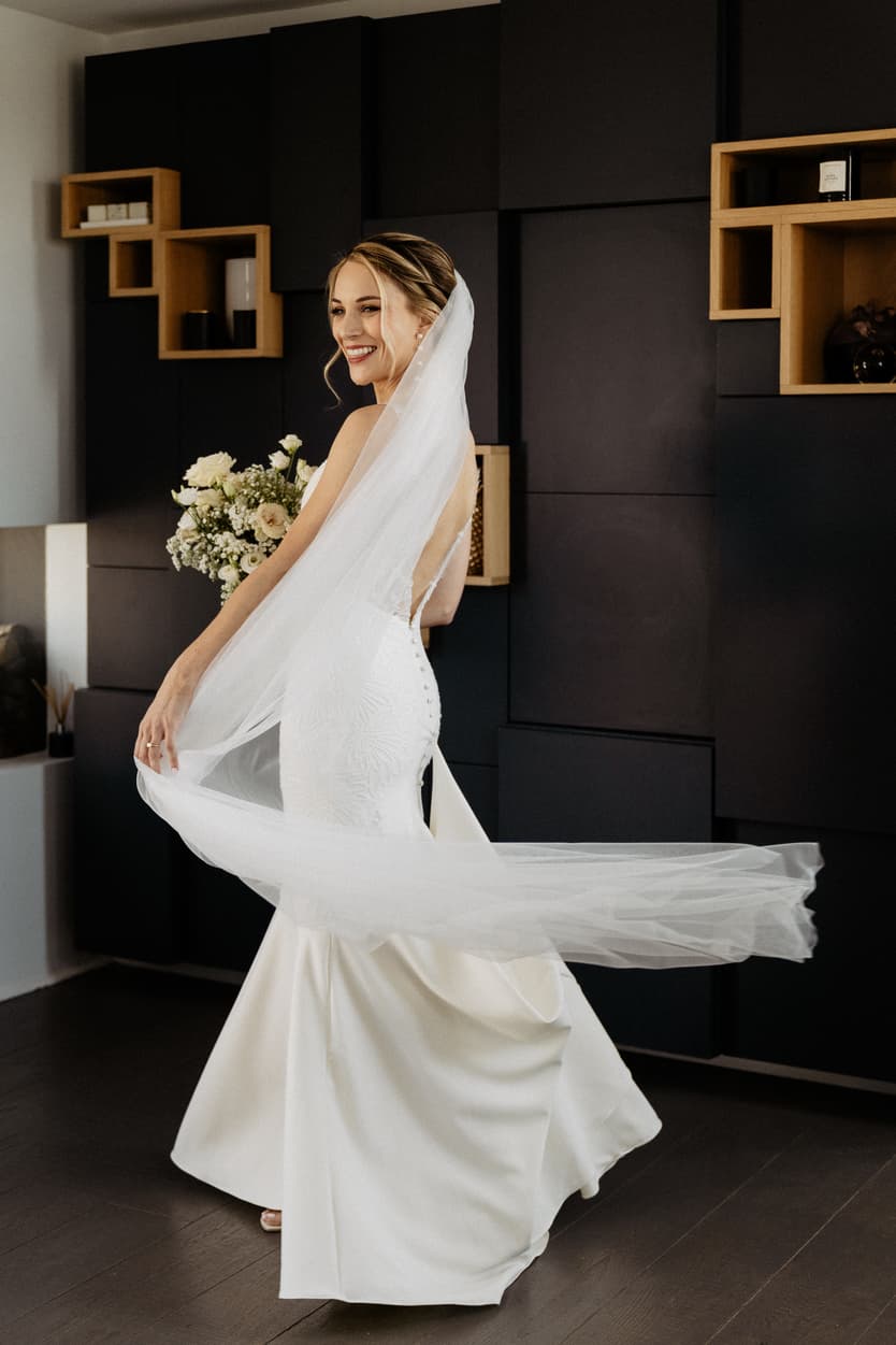 beautiful bride with wedding mermaid dress and long veil
