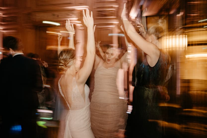 bride and bridemaid team at wedding dance party