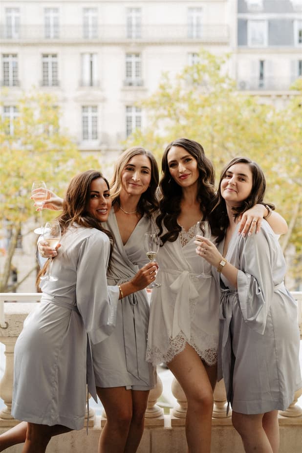 Bride team getting ready and celebrate with champgane in Peninsula paris wedding rooftop photographer