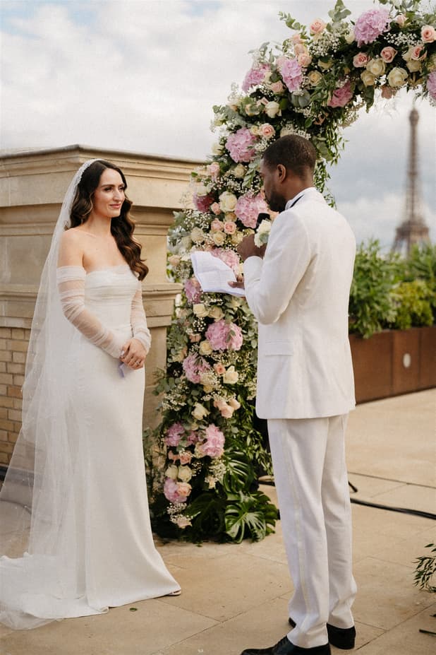 Bride and Groom exchanging vow at Paris Private Rooftop Wedding Ceremony at Peninsula Hotel with Eiffel Tower view