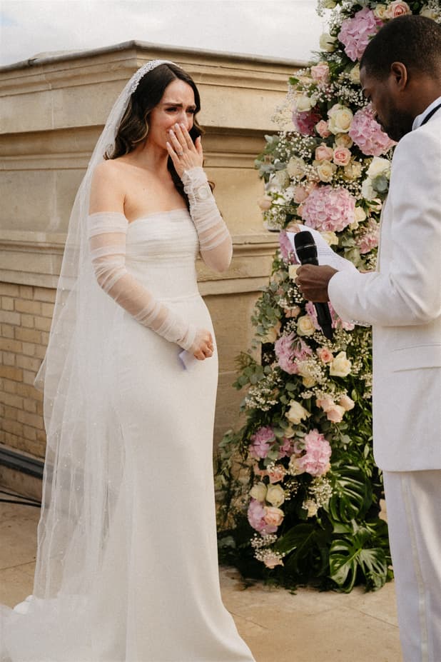 Emotional touching Bride exchanging vow at Paris Private Rooftop Wedding Ceremony at Peninsula Hotel with Eiffel Tower view
