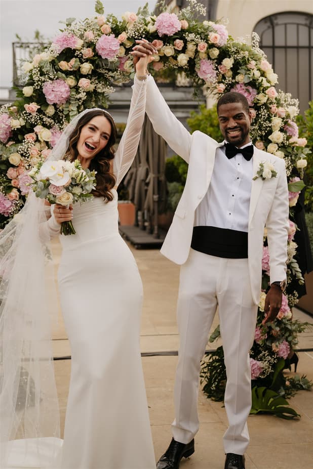Black Groom and White Bride happily celebrate their wedding