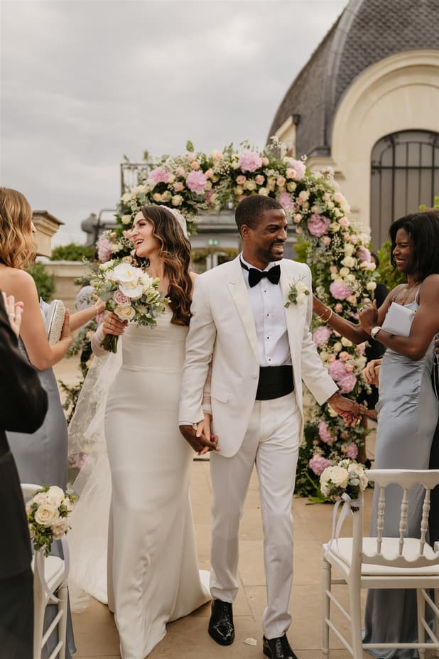 Black Groom and White Bride happily celebrate their wedding