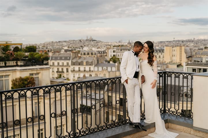 Black Groom and White Bride do after-wedding couple photosession at Private Terrace of Peninsula Paris 