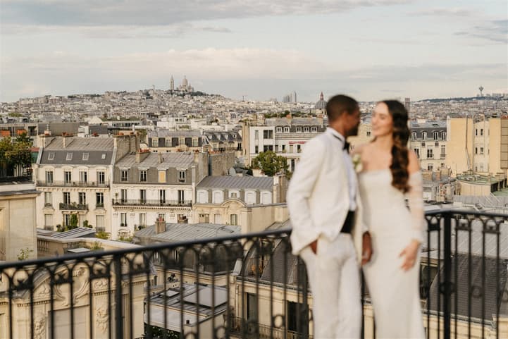 Black Groom and White Bride do after-wedding couple photosession at Private Terrace of Peninsula Paris 