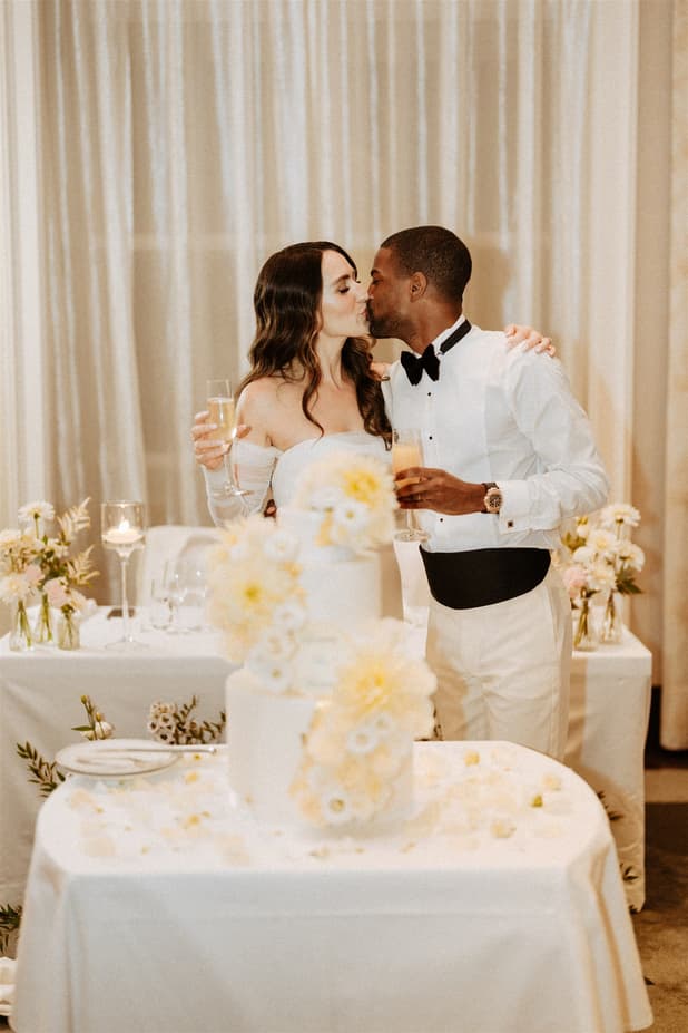 Groom and Bride celebrate with champgane and cake at Peninsula Paris 