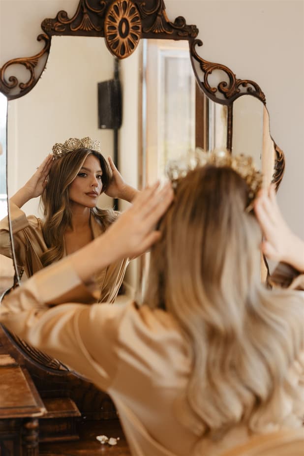 Bride preparation moment wearing golden crown photographer on the wedding day in San Miguel de Allende Mexico