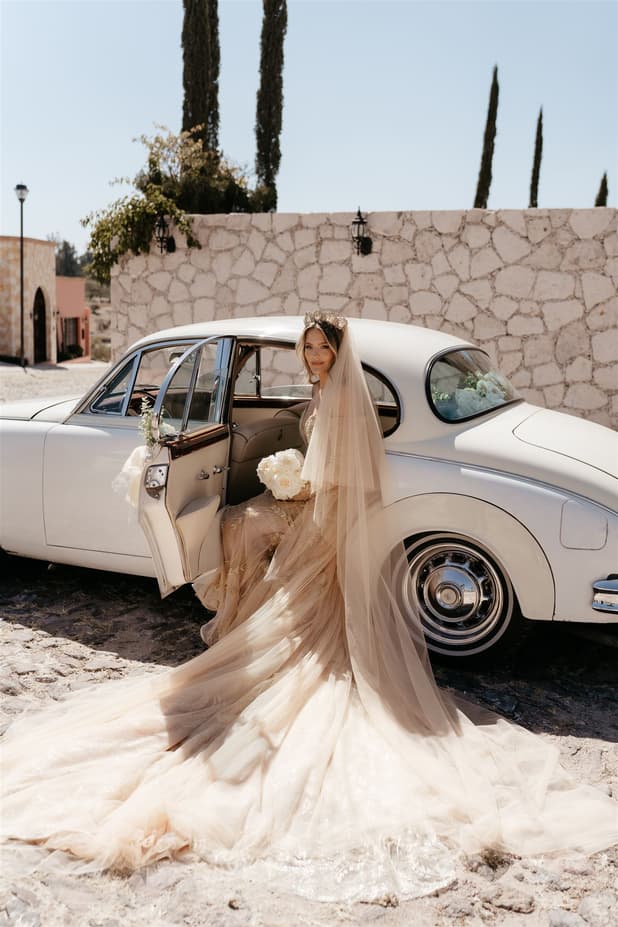 Bride goes to wedding on a vintage car in San Miguel de Allende Mexico