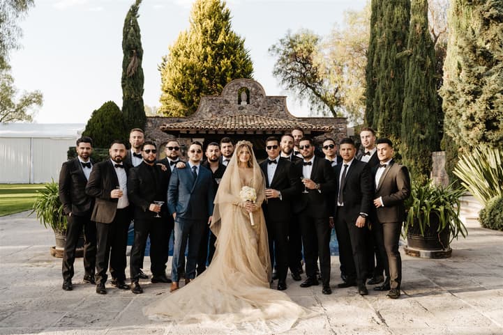 Bride tooks photo with Groom squad