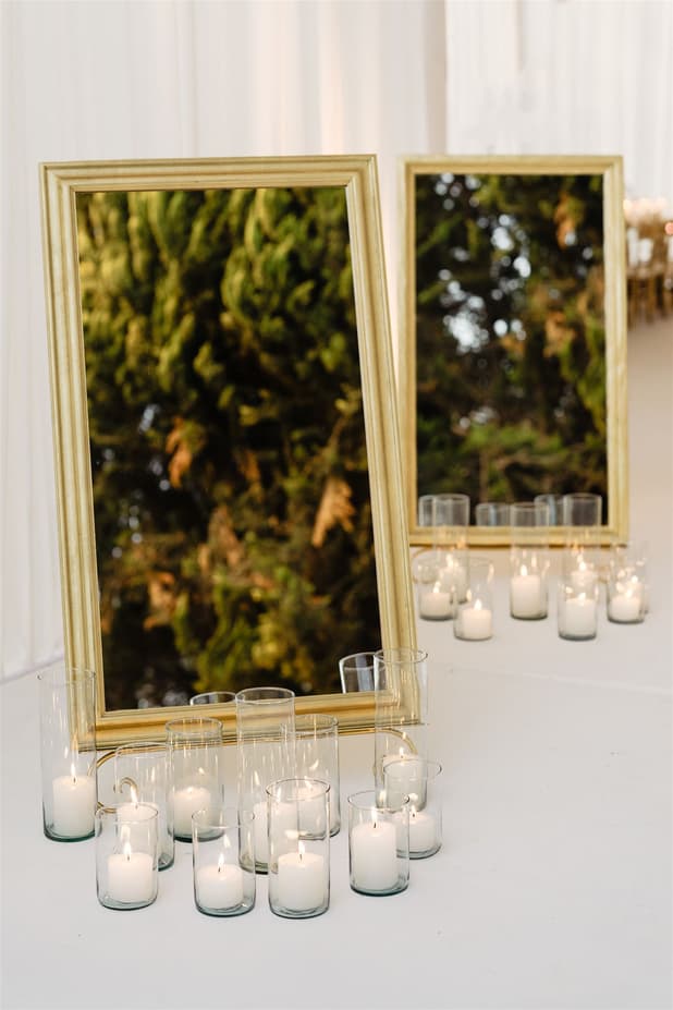 Wedding Reception Withe Golden Decoration with white flowers cascading from the ceiling and cancle lit in San Miguel de Allende Mexico / details photographer